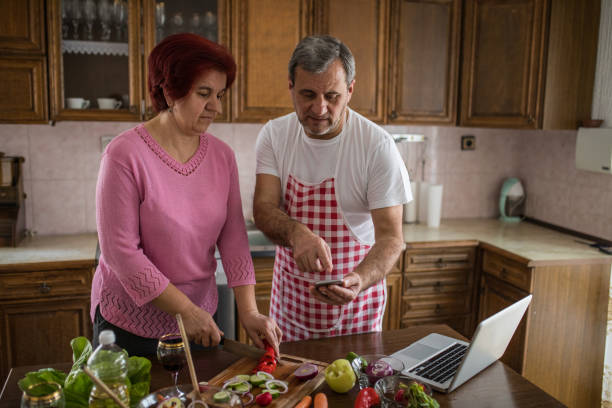 istock Couple making salad together 1189192066