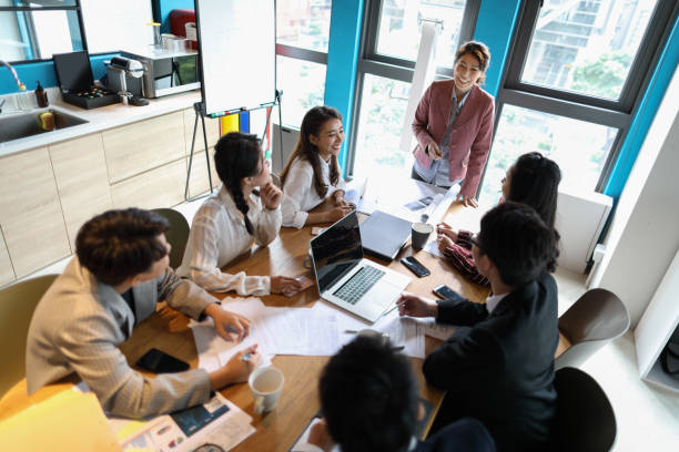 istock Group of business persons in discussion 1189192212