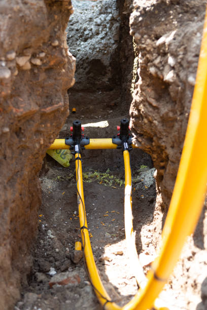 istock Main gas pipe and two connections with signal cables connected using fittings for electrofusion welding. Electro fusion is a method of joining MDPE, HDPE and other plastic pipes together by melting. 1189192263