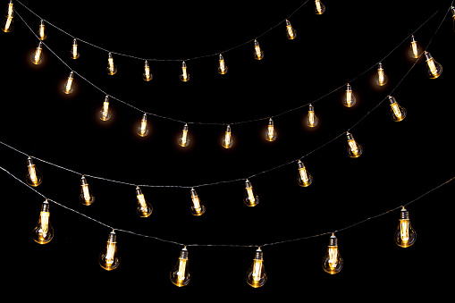 Four rows of hanging light bulbs