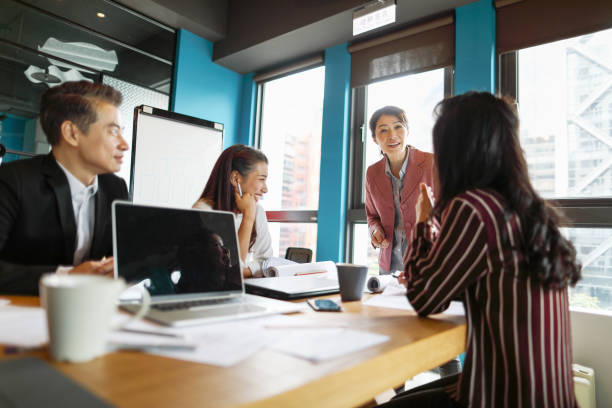 istock Group of business persons in discussion 1189195591