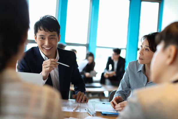 istock Group of business persons in discussion 1189196301