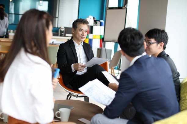 istock Group of business persons in discussion 1189196552