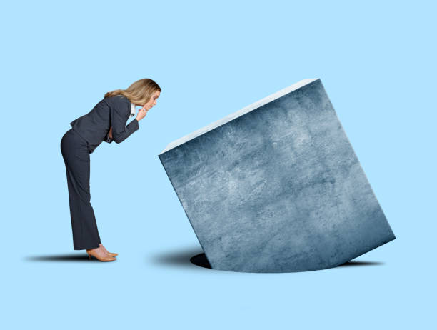 istock Businesswoman Looking At Square Peg not Fitting Into Round Hole 1189201811
