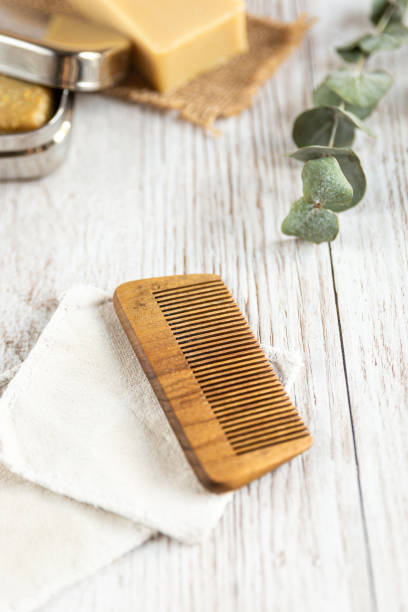 istock Natural bathroom accessories, wooden comb, vertical 1189205431
