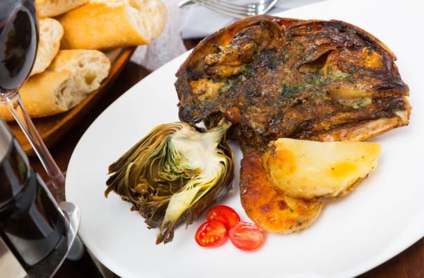 istock Spanish dish - lamb head with artichoke, tomatoes and potatoes 1189205915