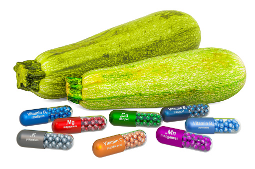 Vitamins and minerals of courgette or zucchini, 3D rendering isolated on white background
