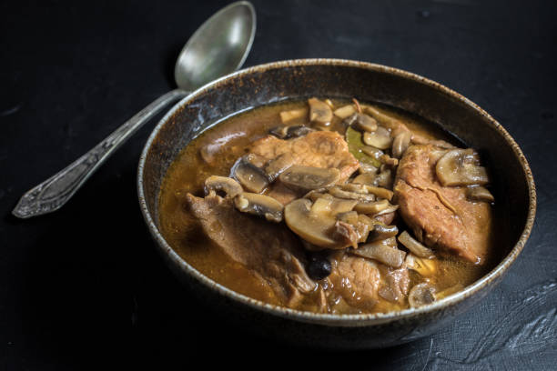 istock Stewed pork chop in a bright mushroom sauce. 1189206163