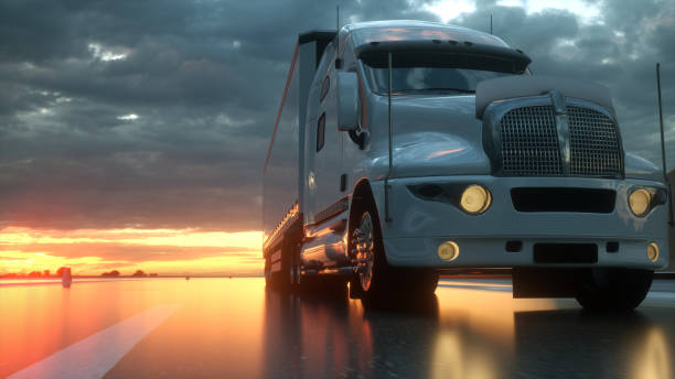 istock Semi trailer on asphalt road highway at sunset - transportation background. 3d rendering 1189207161