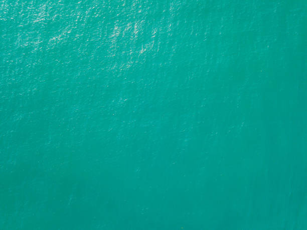 istock Aerial view of turquoise waves, water surface texture 1189207500