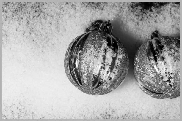 istock Christmas black and white background with silver ornaments and copy space 1189220675