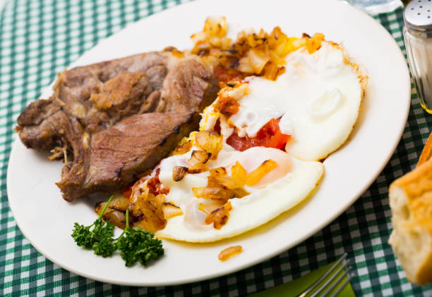istock Tasty cooked fried pork with  fried eggs at  plate 1189223502