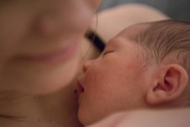 istock A baby in his mother's arms 1189225069