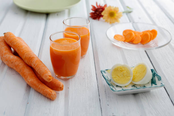 istock Carrot juice and hard boiled eggs. 1189225841
