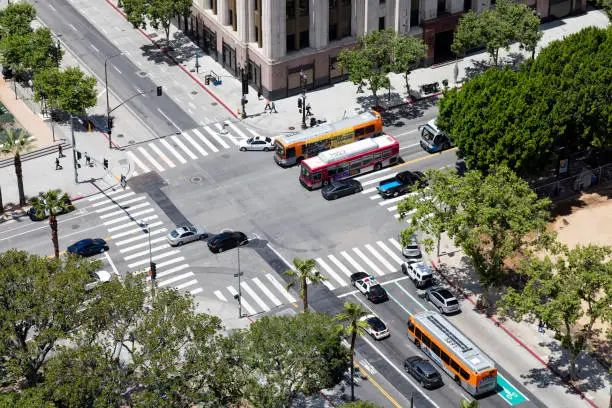 Street scene in Los Angeles, car speeding in downtown district, aerial view, USA.