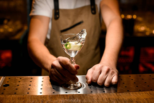 istock Flowing alcohol drink with lime zest on counter 1189226875