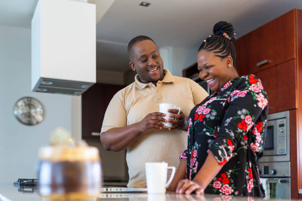 istock African Couple Using a Computer at Home in the Kitchen 1189228161