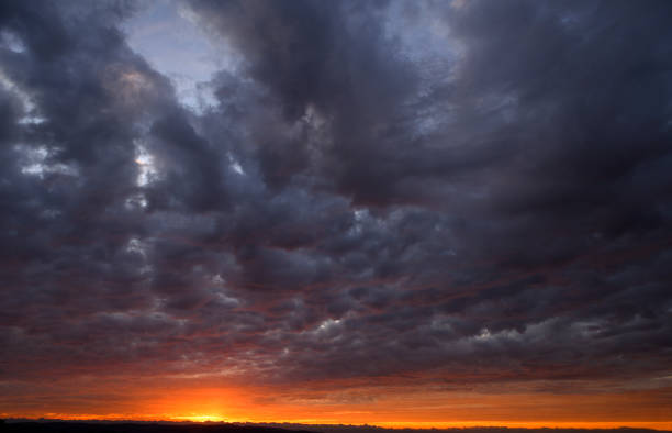 Sunset with approaching storm at California coast.