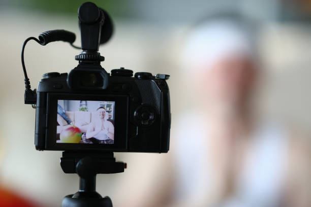 istock Digital Camera Shooting Professional Yoga Man Vlog 1189232740
