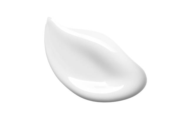 white cream lotion swatch smear smudge cut out. skin care product texture - milk white imagens e fotografias de stock