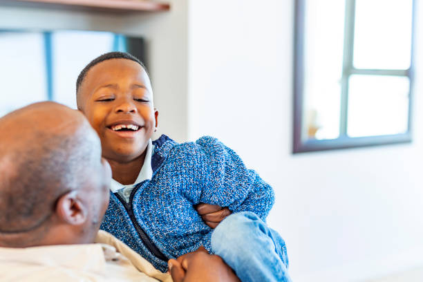 istock Grandson and Grandfather Playing Together 1189238902