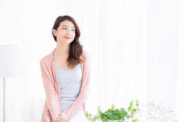 istock asian woman relaxing 1189240842