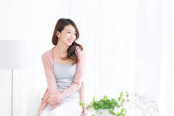 istock asian woman relaxing 1189240898
