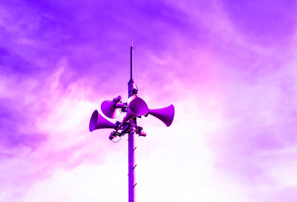 Loudspeaker to be used for the announcement of the event of a disaster.loudspeaker of disaster-forecast with pink, purple, dark blue sky.
