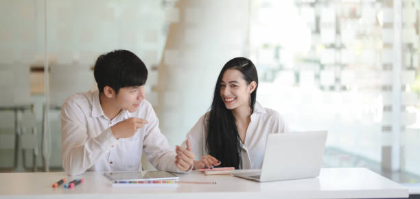 istock Young professional graphic team discussing the project together in modern office 1189260776