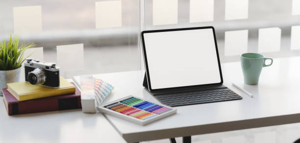 istock Cropped shot of modern designer workplace with blank screen tablet 1189260871