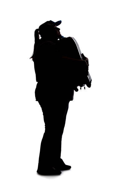 silhouette of a curvy woman waiting with luggage - waiting hourglass people impatient imagens e fotografias de stock