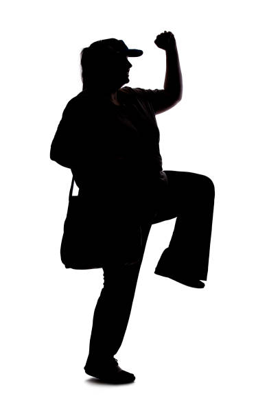 Silhouette of a curvy or plus size woman on a white background.  She is unrecognizable and is wearing casual apparel and walking on white background