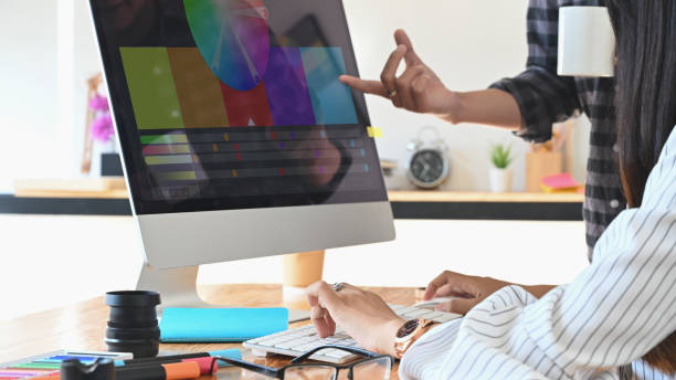 istock Designer graphic creative creativity work with colour wheel w in computer monitor, Discussion and planning concept. 1189266131