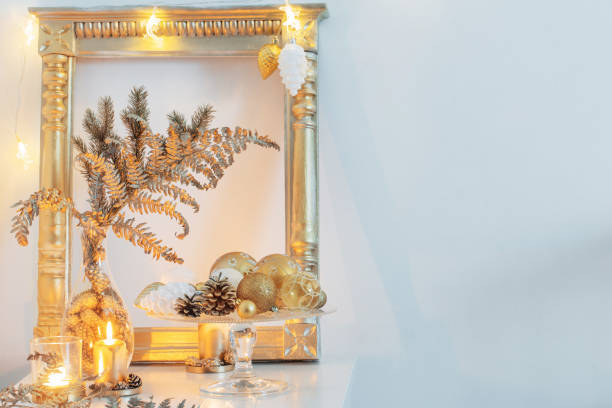 istock Christmas golden decor in white interior 1189267858