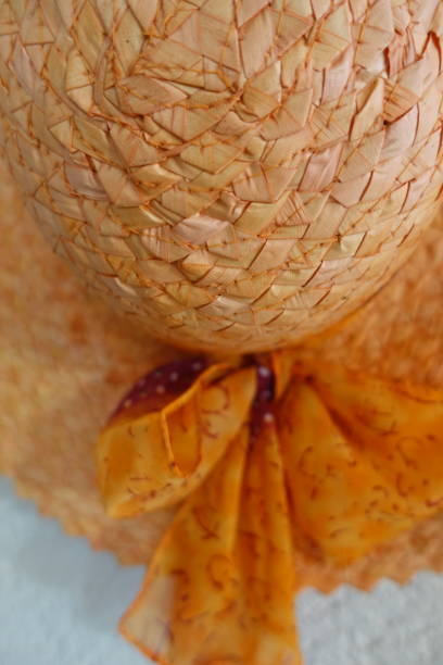 istock Straw hat decorated with a bow tie  Handcrafted product 1189270439