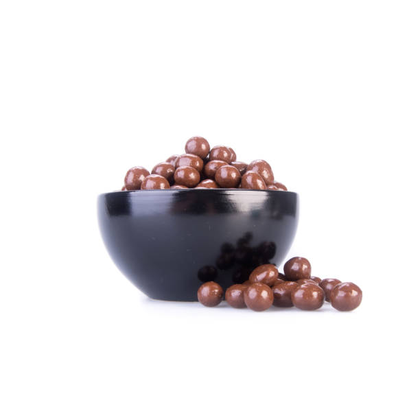 istock chocolate balls in love shape on a background. 1189270610