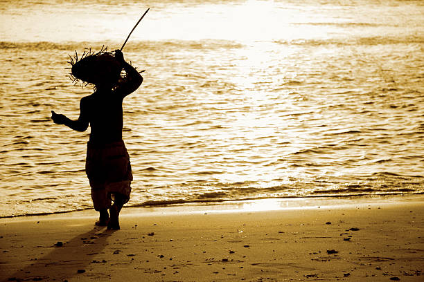istock silhouette of child on sunset sea background 118928459