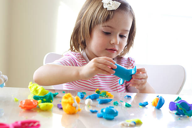 istock Girl playing with play dough 118928888