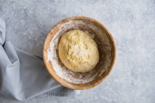 istock The chef prepares the dough - the process of making dough in the kitchen. Chicken eggs, butter, sugar, flour. Cooking, baking, pastry or cookie ingredients 1189288880