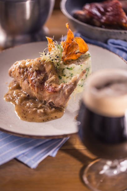 istock Rabbit leg with mashes potatoes and decoration on plate in restaurant 1189289985
