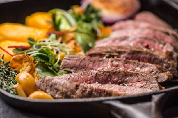 beef flank steak in grill pan with batata puree garlic and herb decoration - flank steak imagens e fotografias de stock