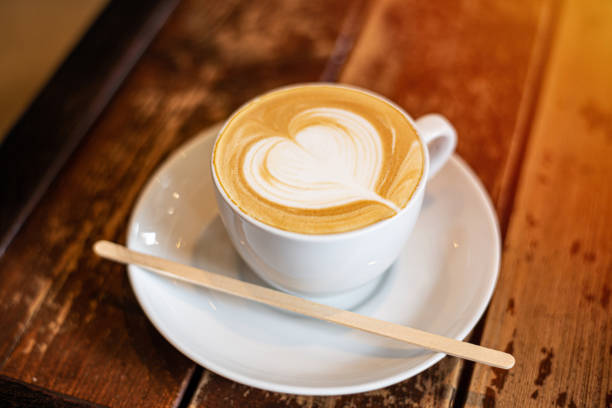 istock coffee cup latte art on wooden background 1189290286