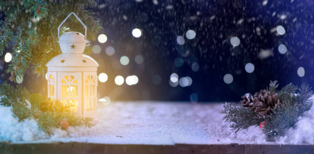 istock Candle oil lamp  on snowy table 1189291253