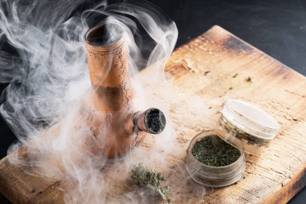 istock Old bong and open grinder cannabis and marijuana in smoke 1189292692
