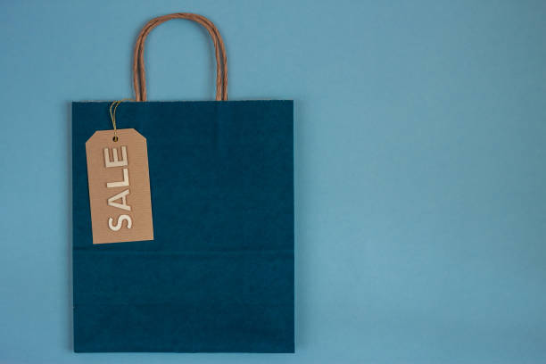 istock blue paper craft bag with sale tag 1189297013