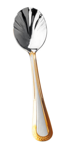 table spoon with golden pattern isolated on white background - old fashioned domestic kitchen old close up imagens e fotografias de stock