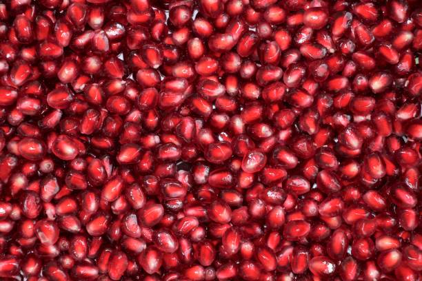 istock Peeled pomegranate grains, background 1189299118