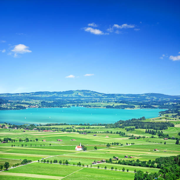 Alpin landscape with the lake Forggensee on background, Germany. Composite photo