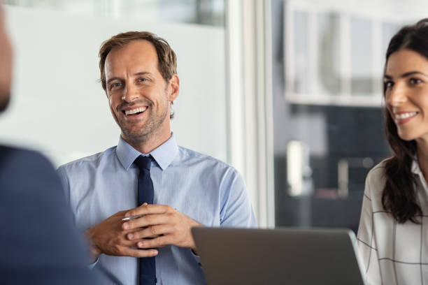 istock Business people laughing during meeting 1189302021