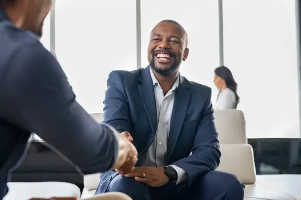 Photo of Business people shaking hands